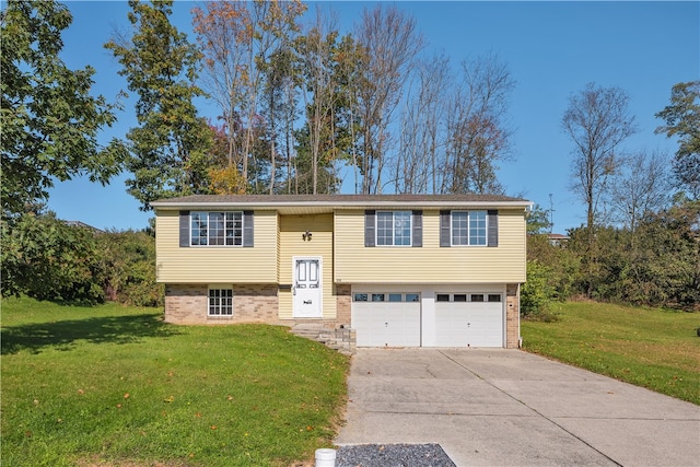 split foyer home featuring a front yard and a garage