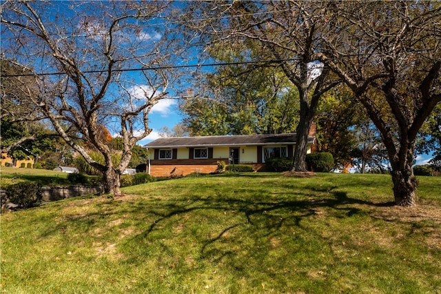 ranch-style house with a front lawn