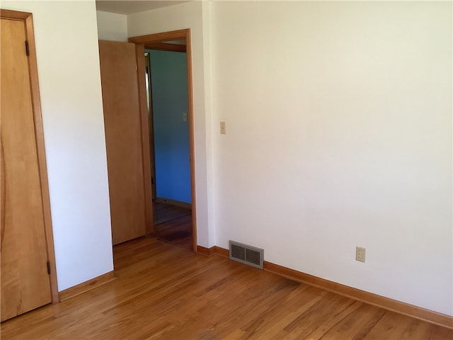 spare room featuring light wood-type flooring