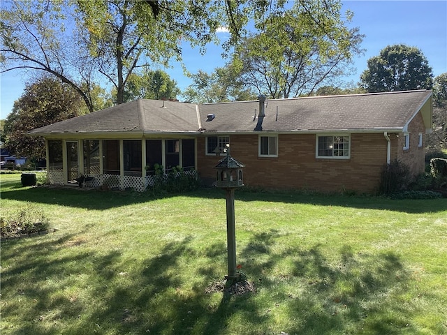 back of house featuring a lawn