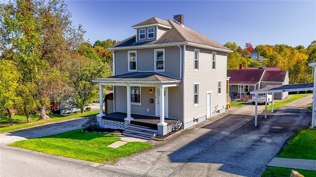 view of front of property with covered porch and a front yard