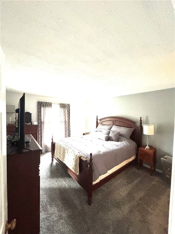 carpeted bedroom featuring a textured ceiling