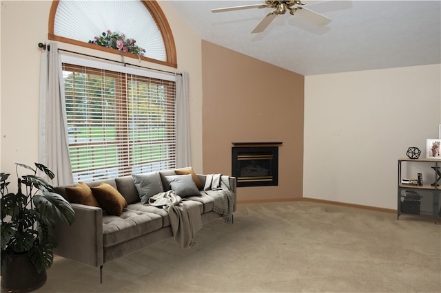 living room with lofted ceiling, carpet floors, and ceiling fan