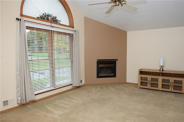 unfurnished living room with ceiling fan and light carpet