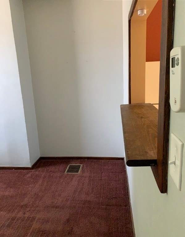 empty room featuring carpet flooring