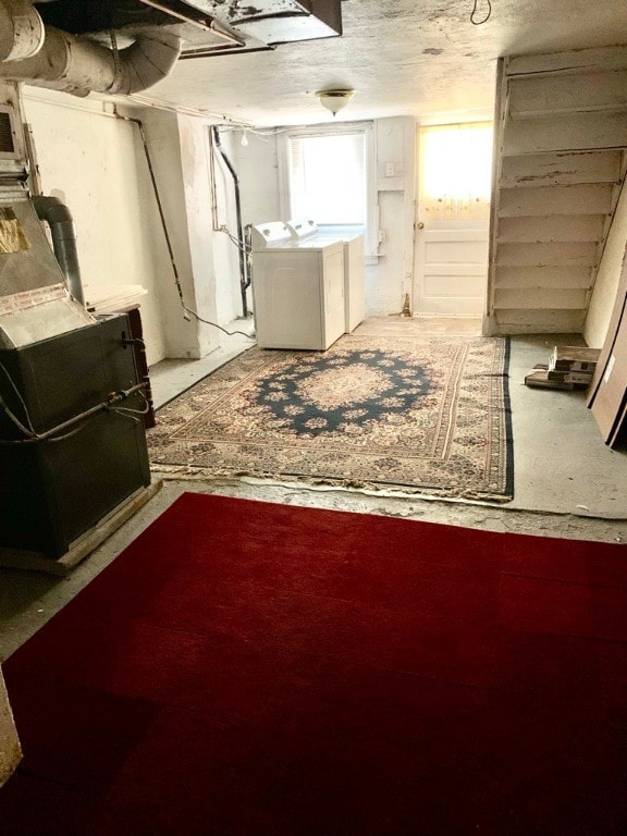 basement with washing machine and clothes dryer