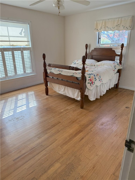 bedroom featuring light hardwood / wood-style flooring and ceiling fan