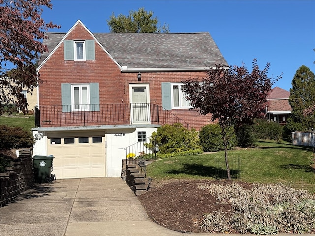 view of front facade with a front lawn and a garage