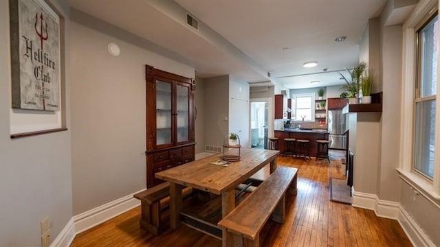 dining room with hardwood / wood-style floors