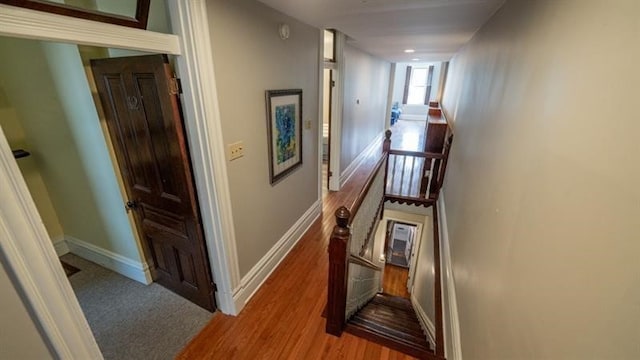 hall with wood-type flooring