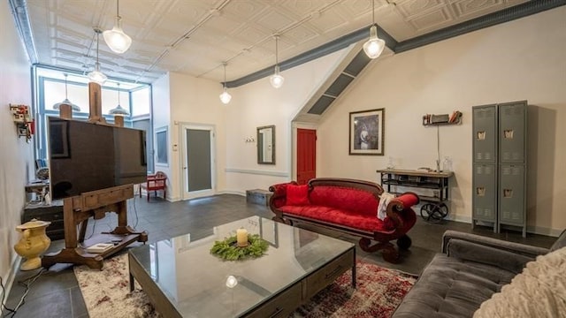 living room featuring ornamental molding and a high ceiling