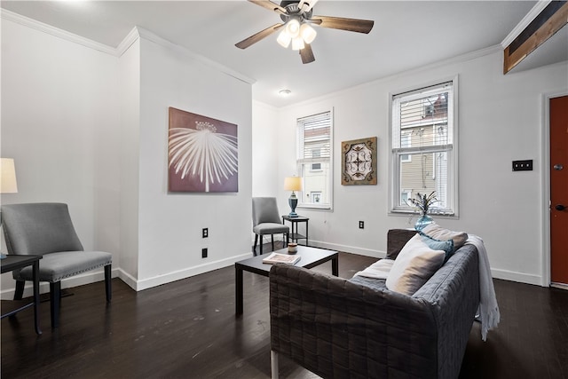 living room featuring dark hardwood / wood-style floors, ceiling fan, and crown molding