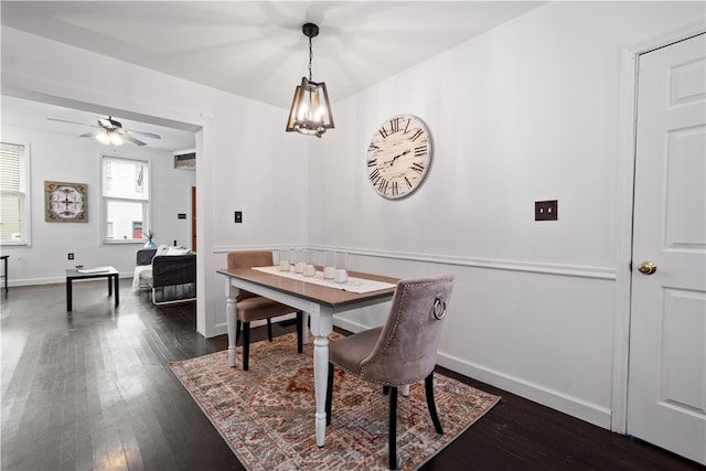 dining room featuring dark hardwood / wood-style floors and ceiling fan with notable chandelier