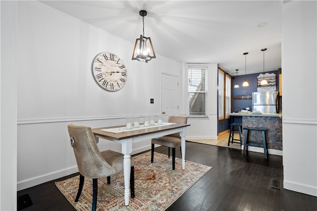 dining room with hardwood / wood-style floors