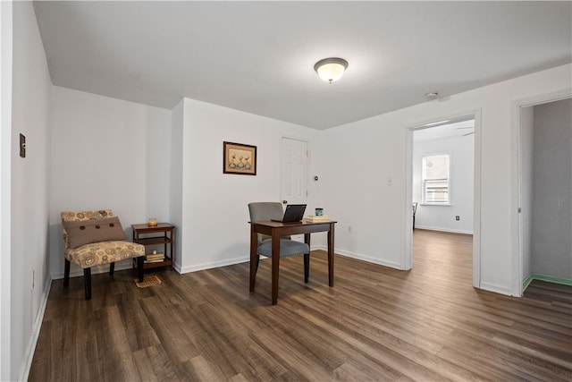 office with dark hardwood / wood-style flooring