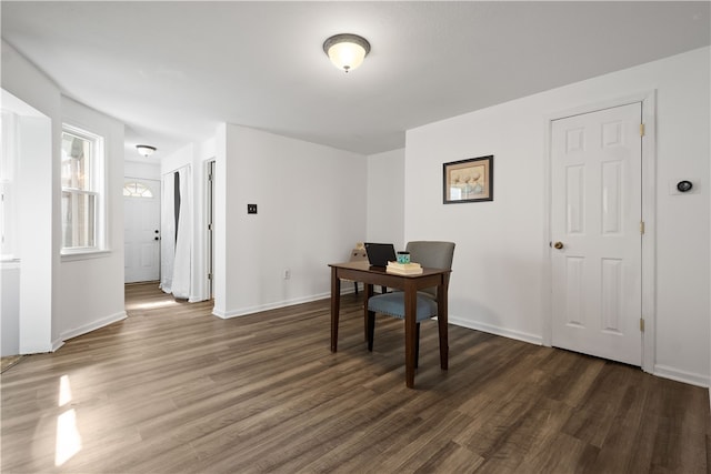 dining space featuring dark hardwood / wood-style floors