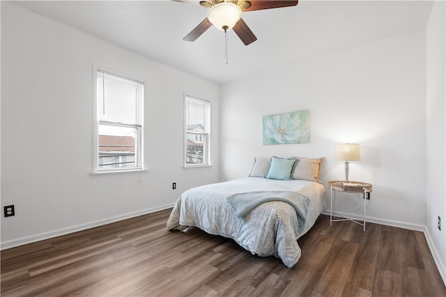 bedroom with ceiling fan and dark wood-type flooring