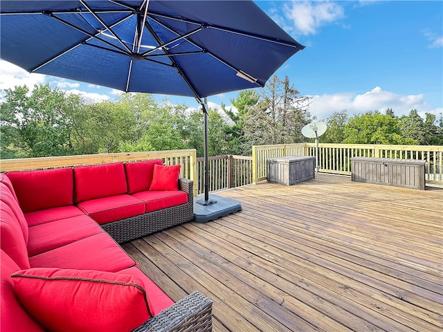 wooden terrace featuring an outdoor hangout area