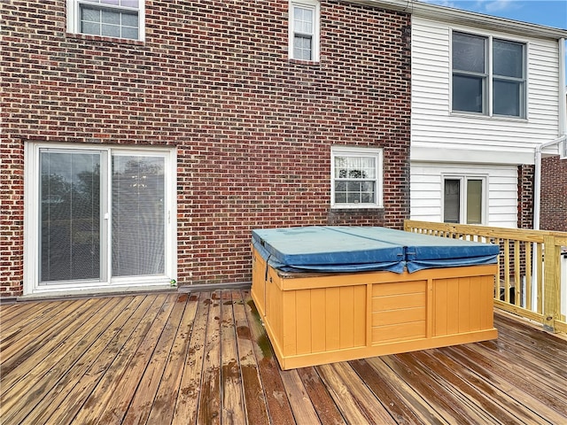 deck featuring a hot tub