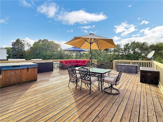 deck with a hot tub and an outdoor hangout area