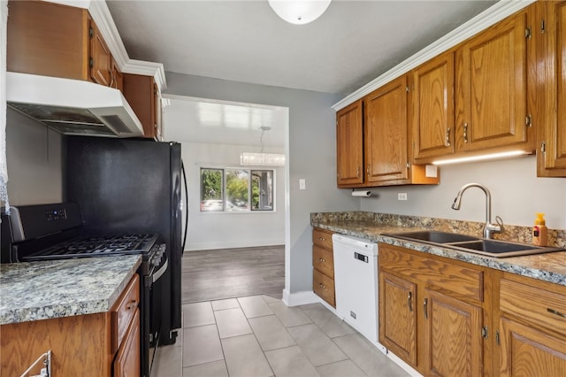 kitchen featuring white dishwasher, black gas range, sink, and light hardwood / wood-style flooring