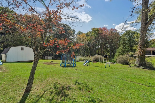 view of yard with a playground, an outdoor structure, and a trampoline