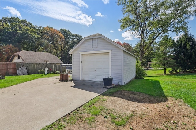 garage featuring a lawn