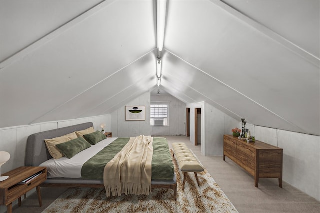 bedroom with light carpet and lofted ceiling