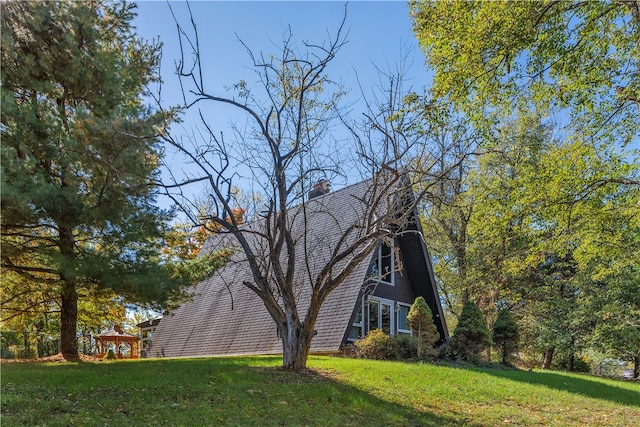 view of home's exterior featuring a lawn