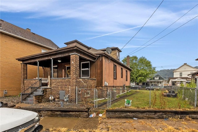 view of property exterior with covered porch