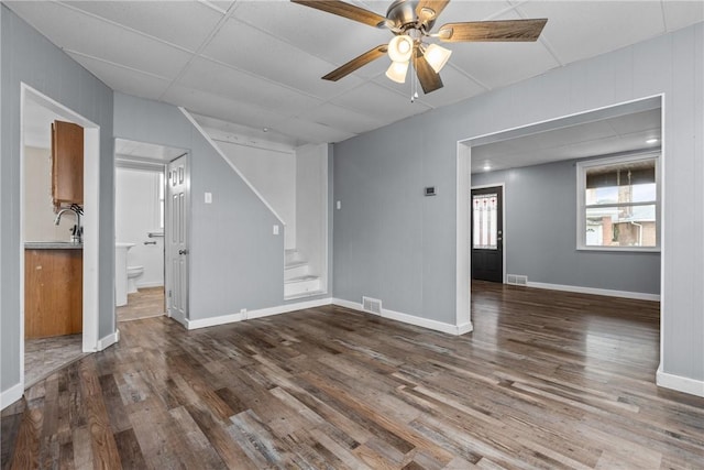 interior space with ceiling fan and dark hardwood / wood-style floors