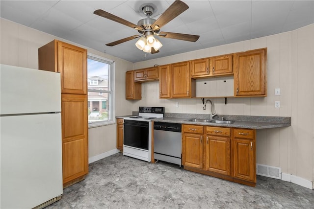 kitchen featuring electric range, sink, ceiling fan, stainless steel dishwasher, and white refrigerator