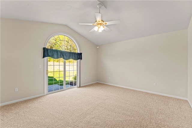 carpeted spare room with lofted ceiling and ceiling fan