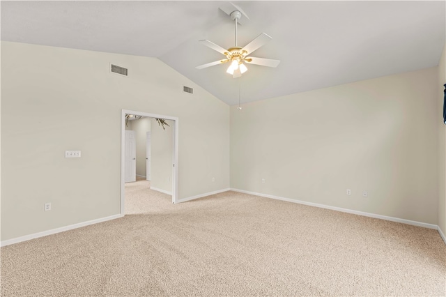 unfurnished room with ceiling fan, vaulted ceiling, and light colored carpet