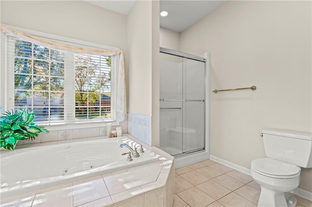 bathroom with plus walk in shower, toilet, and tile patterned flooring