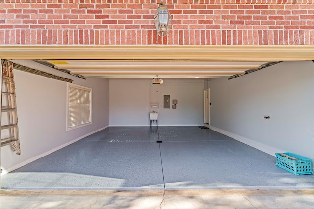 garage with a garage door opener and electric panel