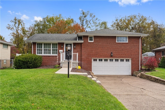 tri-level home featuring a front lawn and a garage