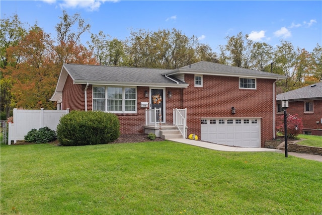 tri-level home with a front yard and a garage