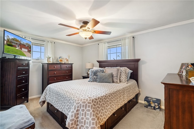 carpeted bedroom with multiple windows, crown molding, and ceiling fan