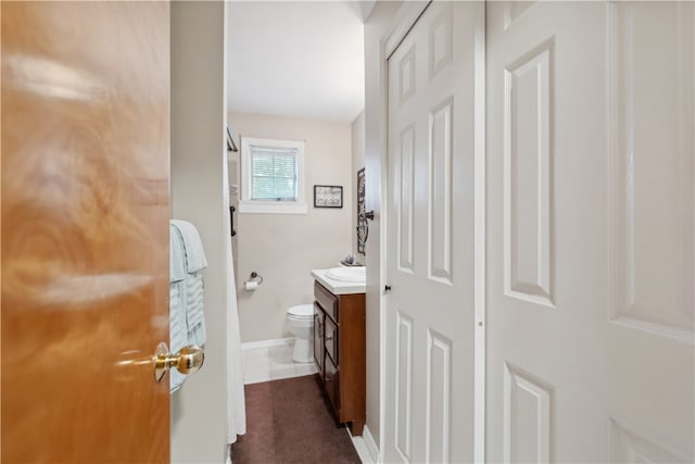 bathroom with toilet and vanity