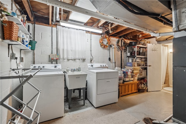 laundry room featuring sink and separate washer and dryer