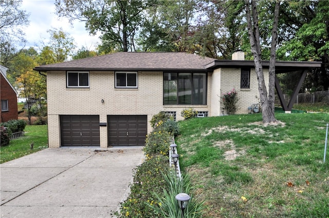 view of front of house featuring a front yard and a garage