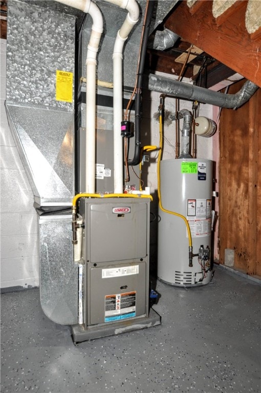 utility room featuring water heater