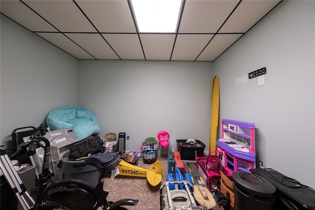 playroom featuring a paneled ceiling