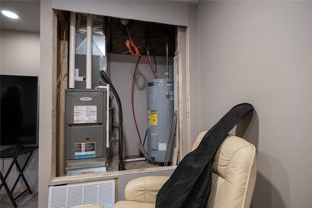 utility room featuring electric water heater