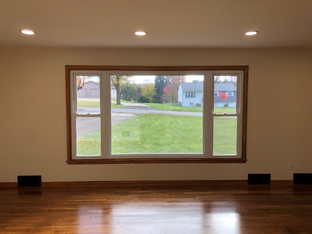 unfurnished room featuring dark wood-type flooring