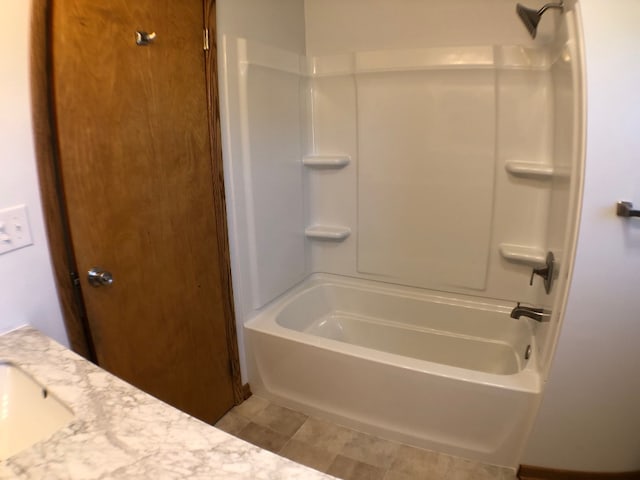 bathroom featuring tile patterned floors and tub / shower combination