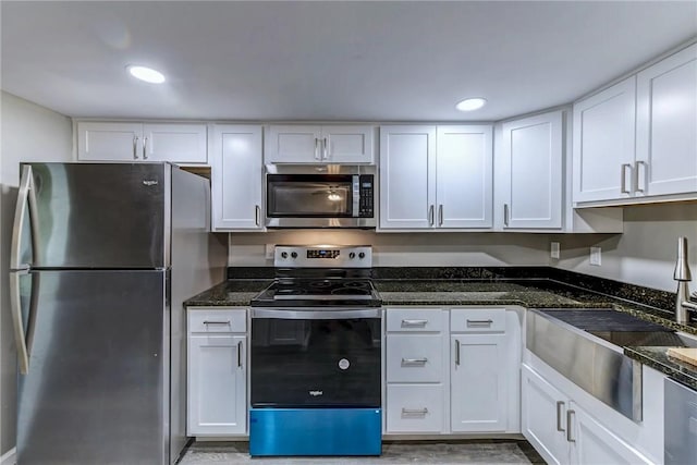 kitchen with white cabinetry, appliances with stainless steel finishes, and a sink