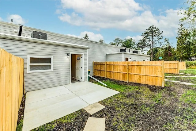back of house with a patio and fence