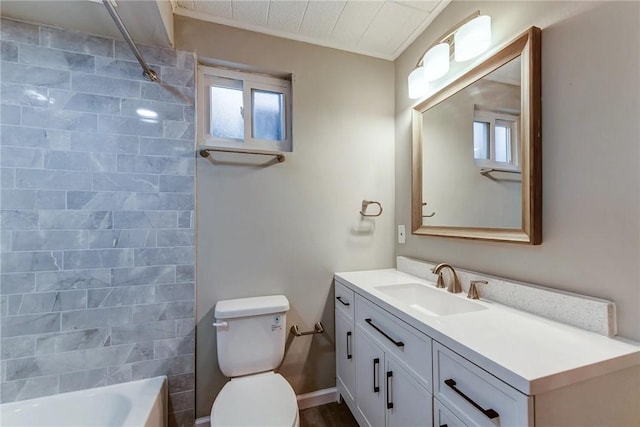 full bath with toilet, vanity, and  shower combination